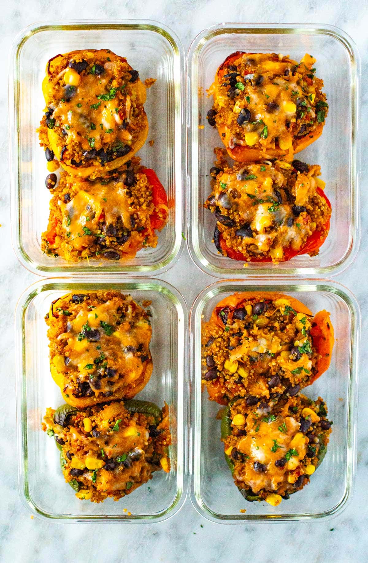 Vegetarian stuffed peppers in glass meal prep bowls