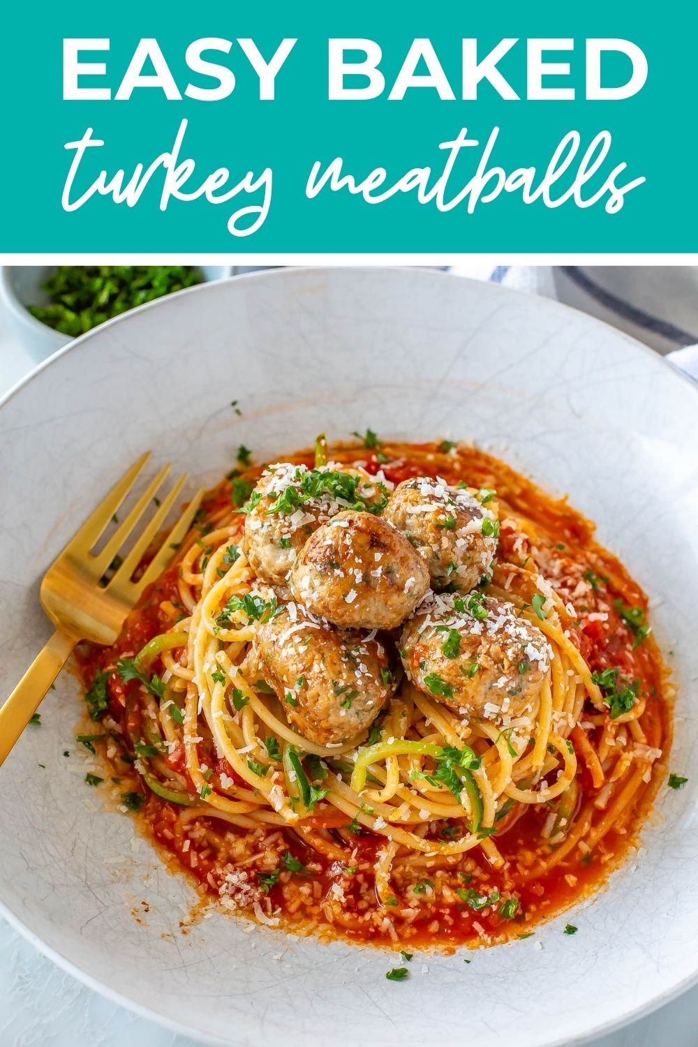 Turkey meatballs served over pasta, with text that says 'Easy Baked Turkey Meatballs'.