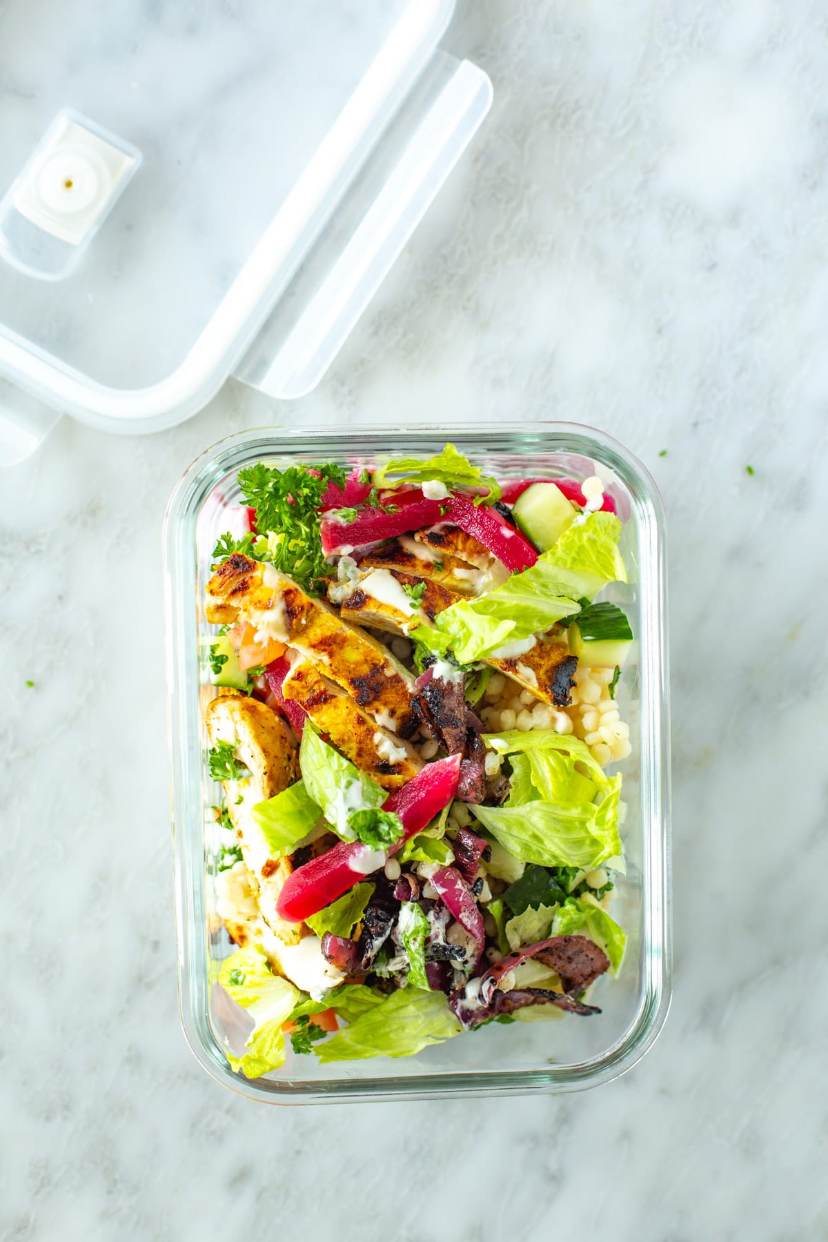 Chicken shawarma bowl in a glass meal prep container