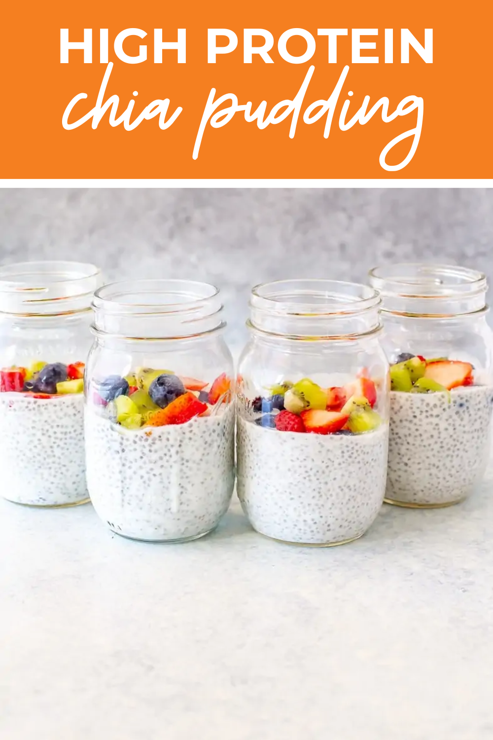 4 chia puddings topped with fruits and berries in mason jars.