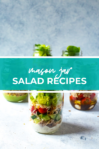 shot of four mason jar salads with blue banner in the middle reading "mason jar salad recipes"