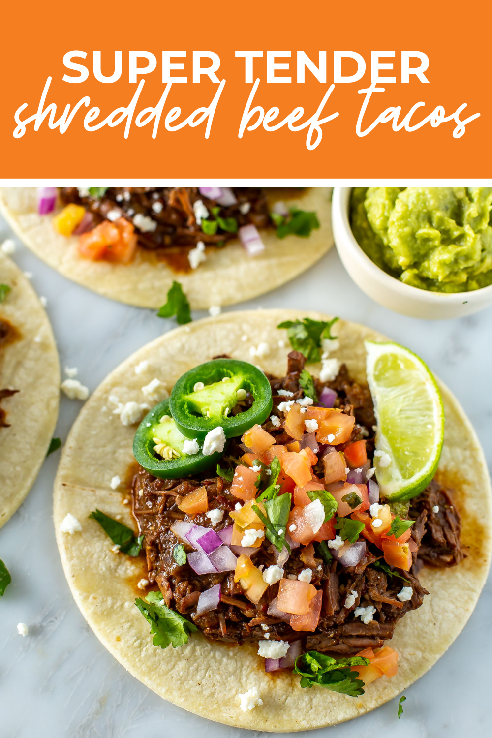 overhead shot of plated dish with orange banner on the top- reading "super tender shredded beef tacos"