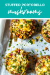 Row of stuffed portobello mushrooms cooked on baking sheet