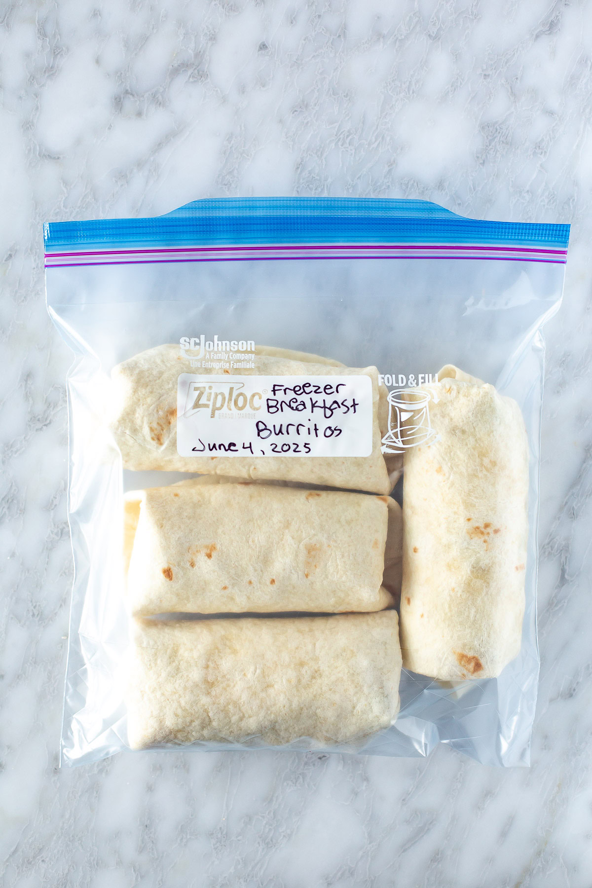 overhead shot of breakfast burrito in a zipper bag ready for storing