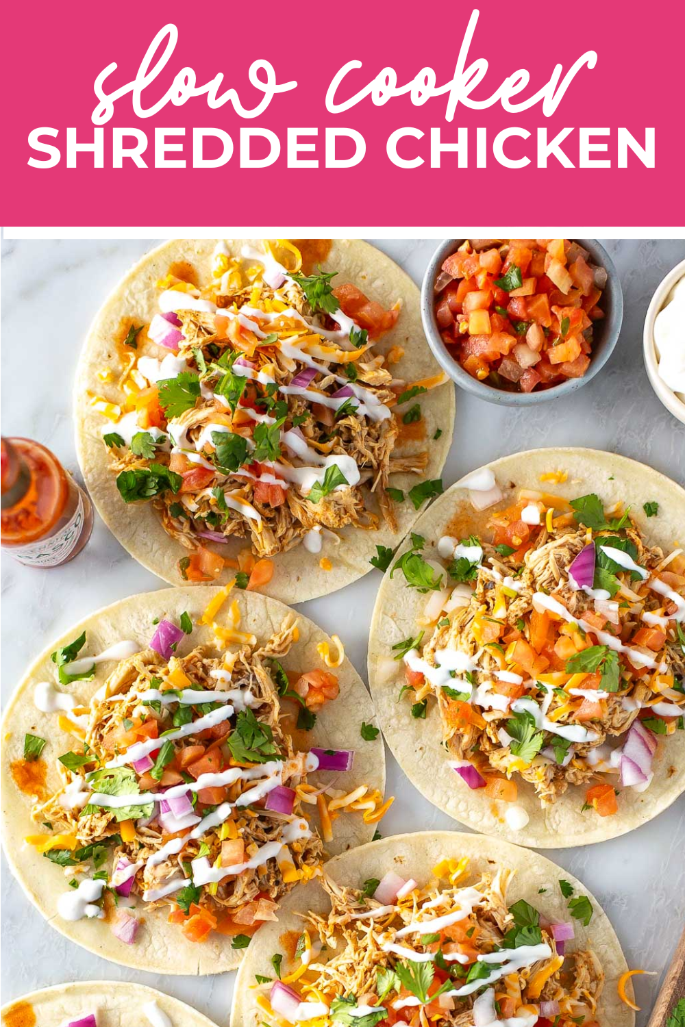 Overhead shot of plated dish with pink banner on the top - reading "slow cooker shredded chicken"