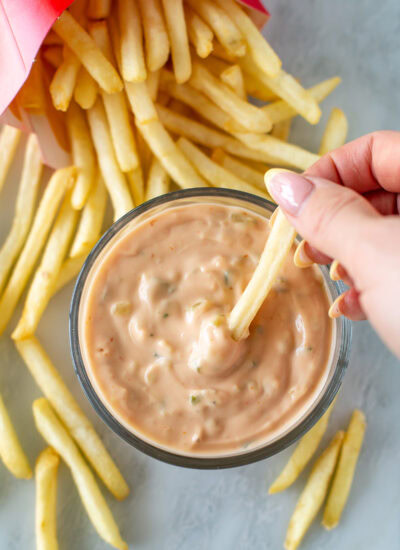 Overhead shot of big mac sauce h in a small bowl, next to french fries - 3