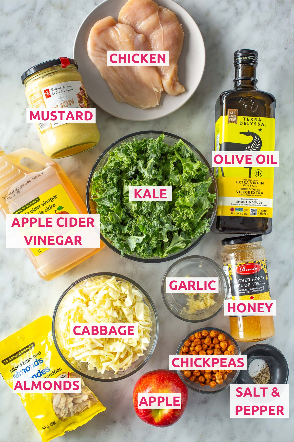 Overhead shot of all the ingredients for kale crunch salad with labels.
