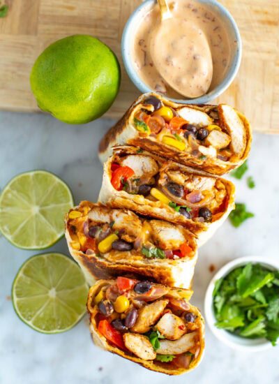 Overhead shot of a stack of cut Southwest chicken wraps on a plate 5