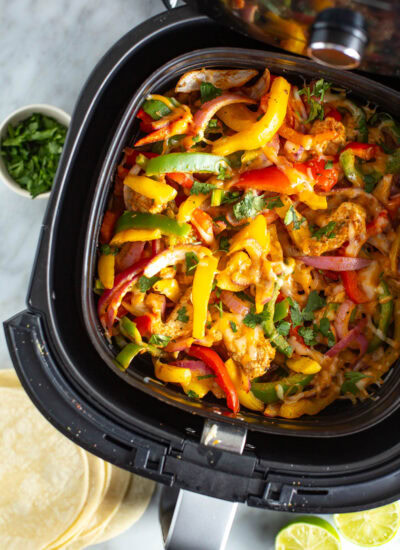 overhead shot of air fryer chicken fajitas in basket