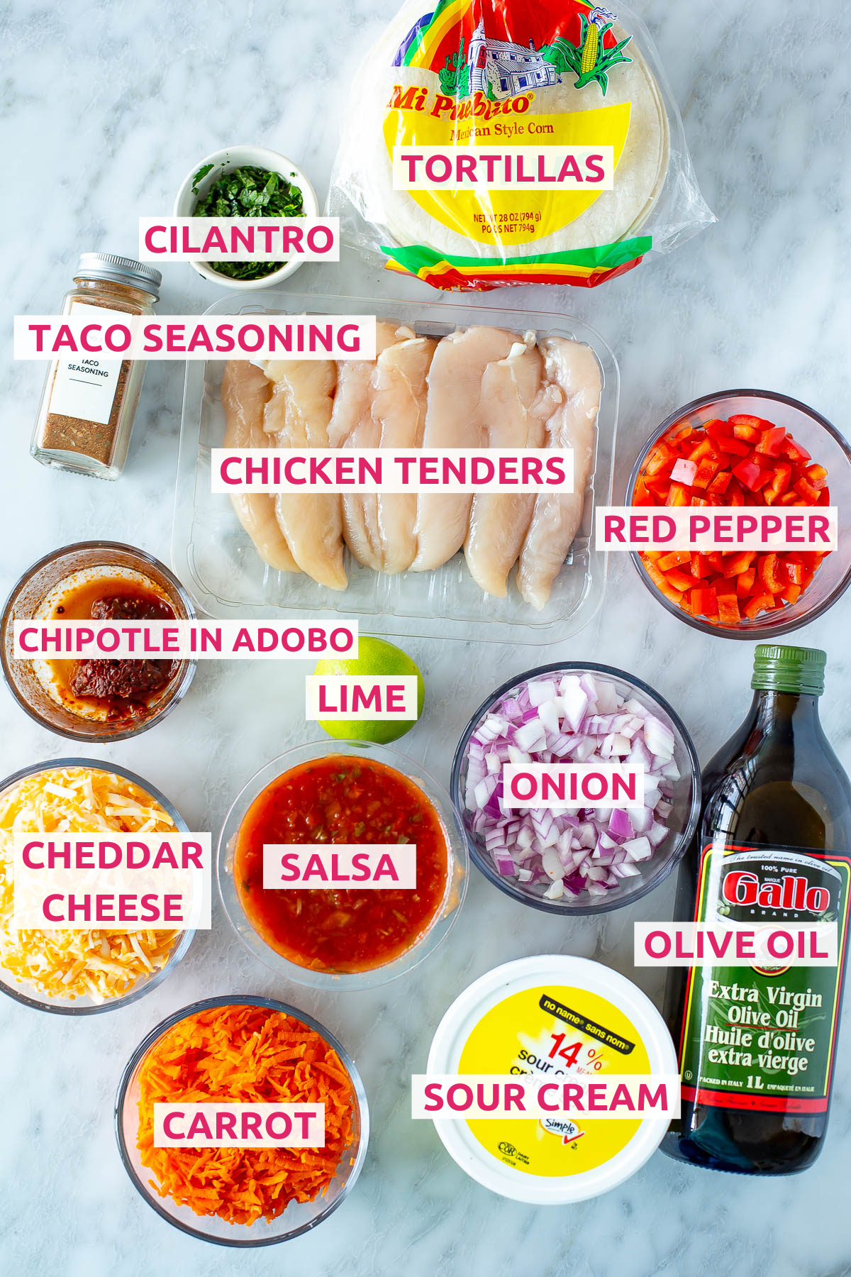 Overhead shot of all the ingredients for Cheesy Pulled Chicken Tacos with labels.