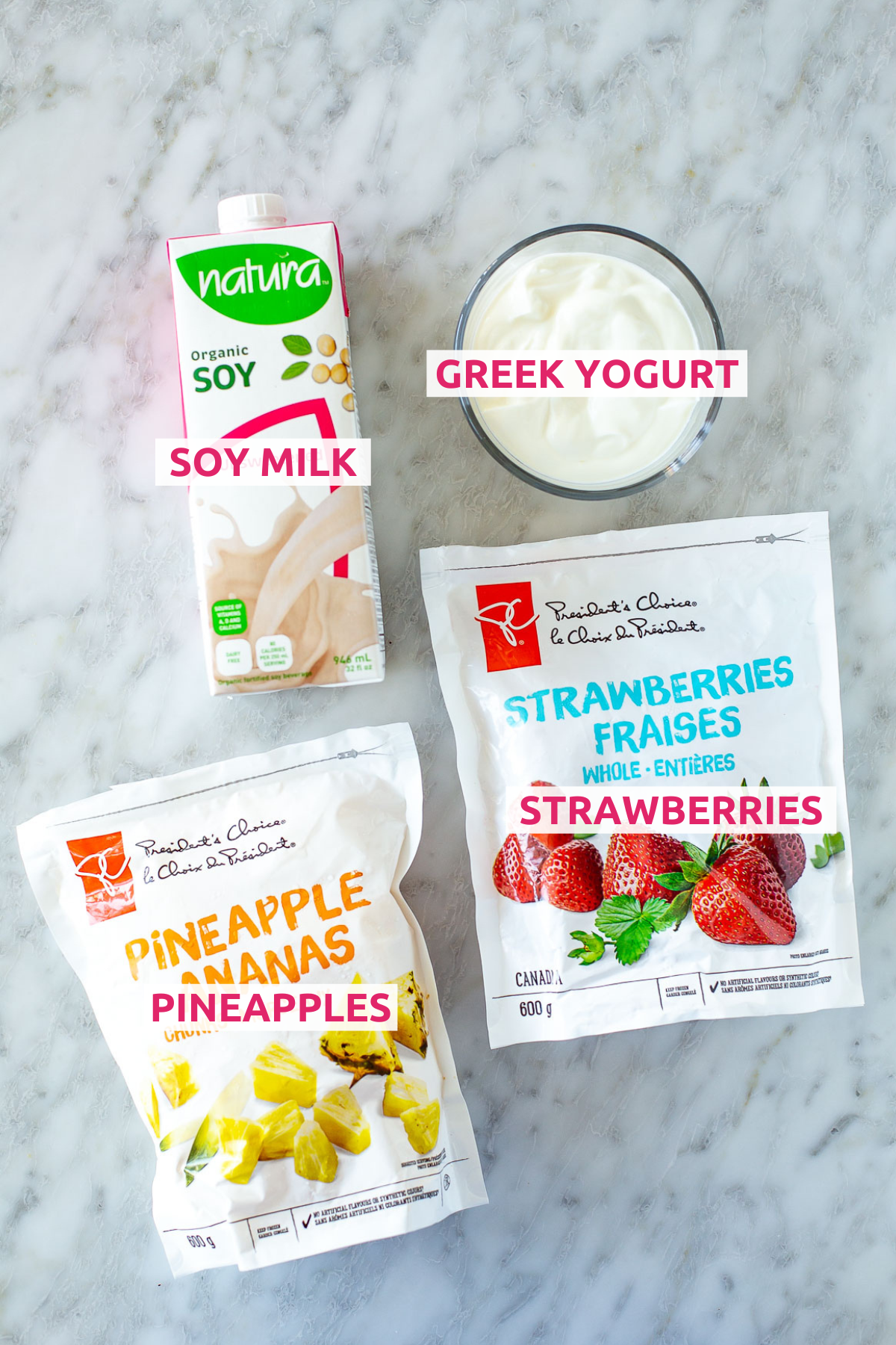 Overhead shot of the ingredients for the Easy Strawberry Pineapple Smoothie with labels.