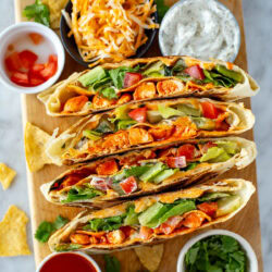 Overhead shot of buffalo chicken crunchwraps with ingredients