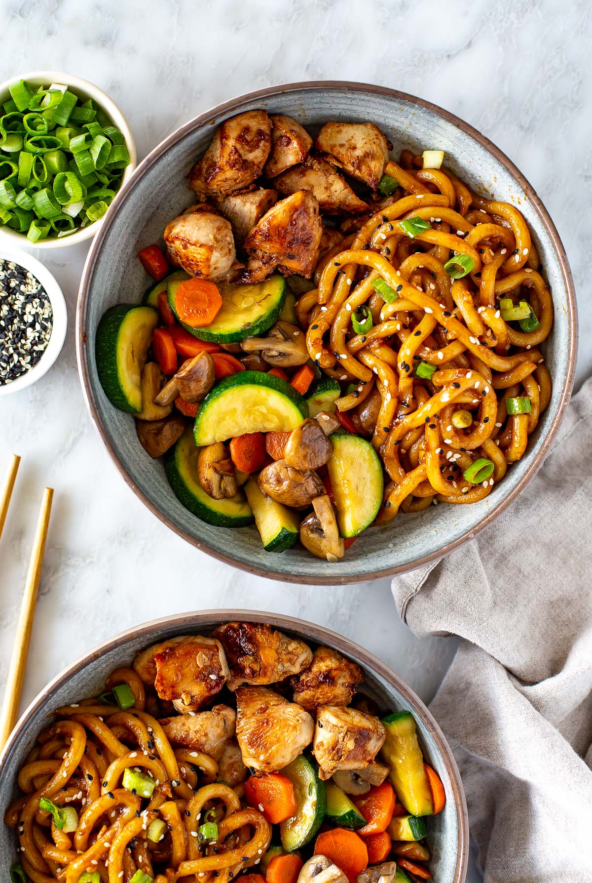 Overhead close up shot of plated hibachi noodles with chicken and vegetable