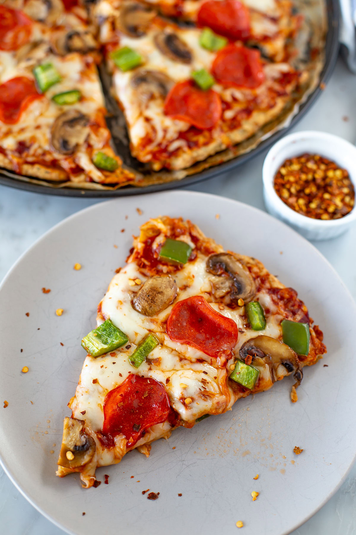 Chicken crust pizza slice