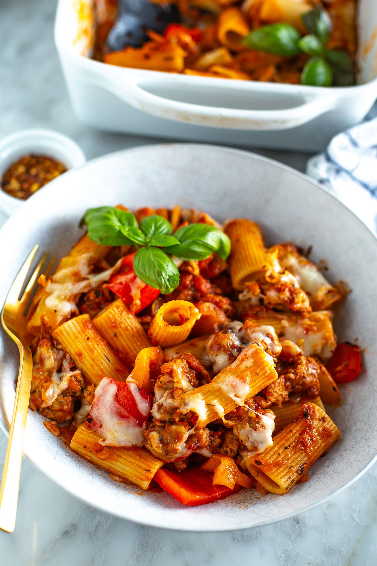 Sausage pasta bake plated close up