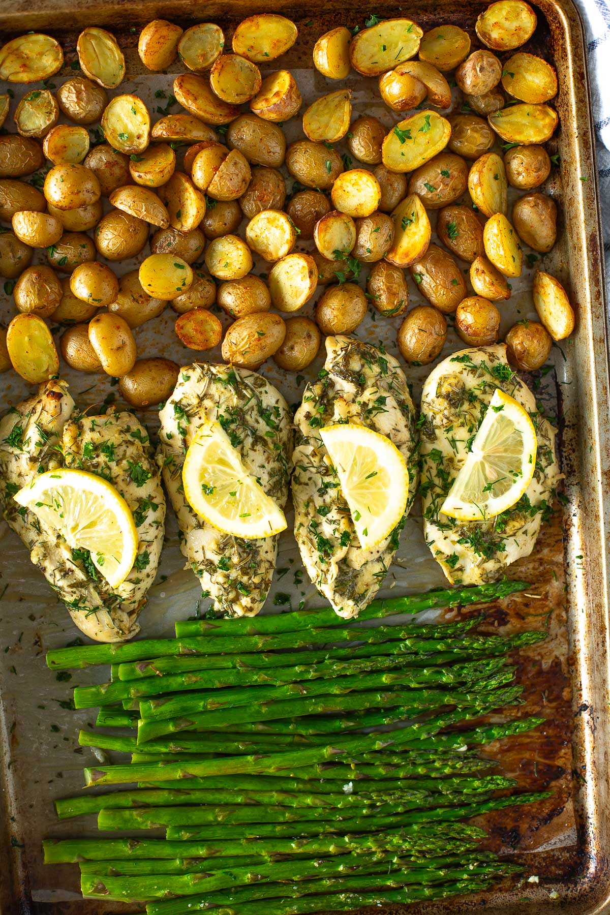 Sheet pan chicken and asparagus with baby potatoes close up